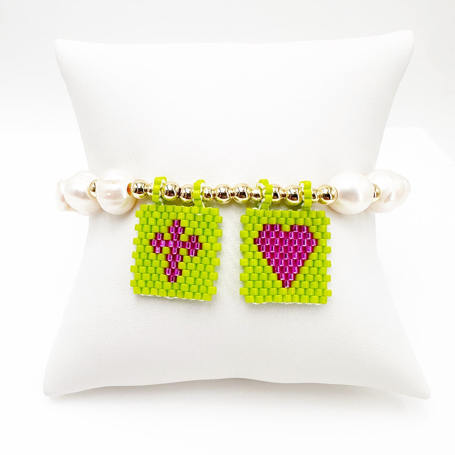 Handcrafted Pearl Bracelet with Gold-Plated Beads and Striking Apple Green & Purple Flags