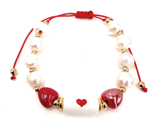 Handcrafted Pearl Bracelet with Gold-Plated Beads and Trio of Romantic Red Hearts